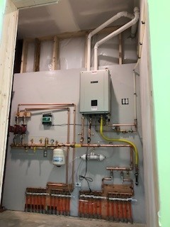 Tankless Water Heater by KMS Plumbing